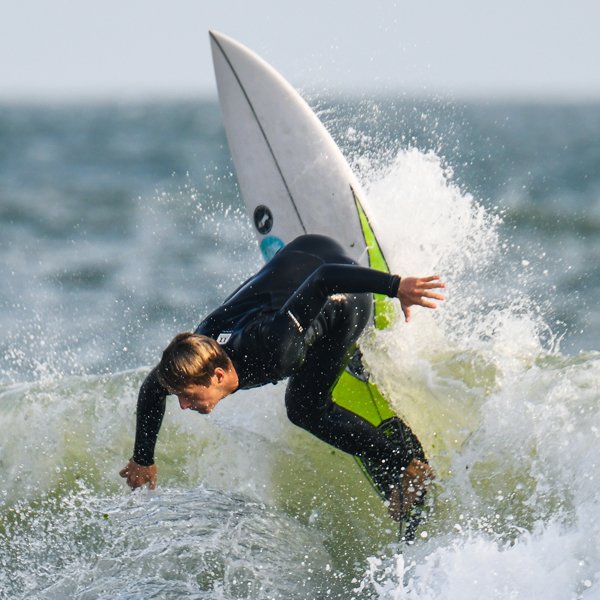 man surfing wave in gul wetsuit, click for y39